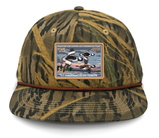 Duck Stamp Hat Buffleheads '26-'27 - Mossy Oak Shadowgrass Rope